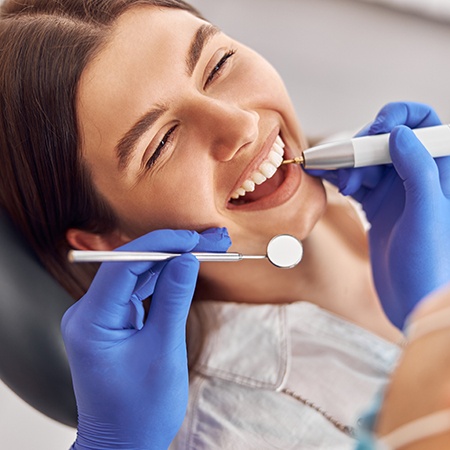 Woman smiling during a dental checkup