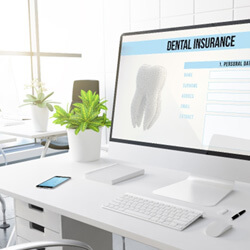 dental insurance form on desktop in office