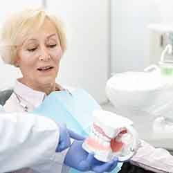 Patient in Savannah talking with dentist about dentures