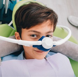 Young boy with nitrous oxide mask 